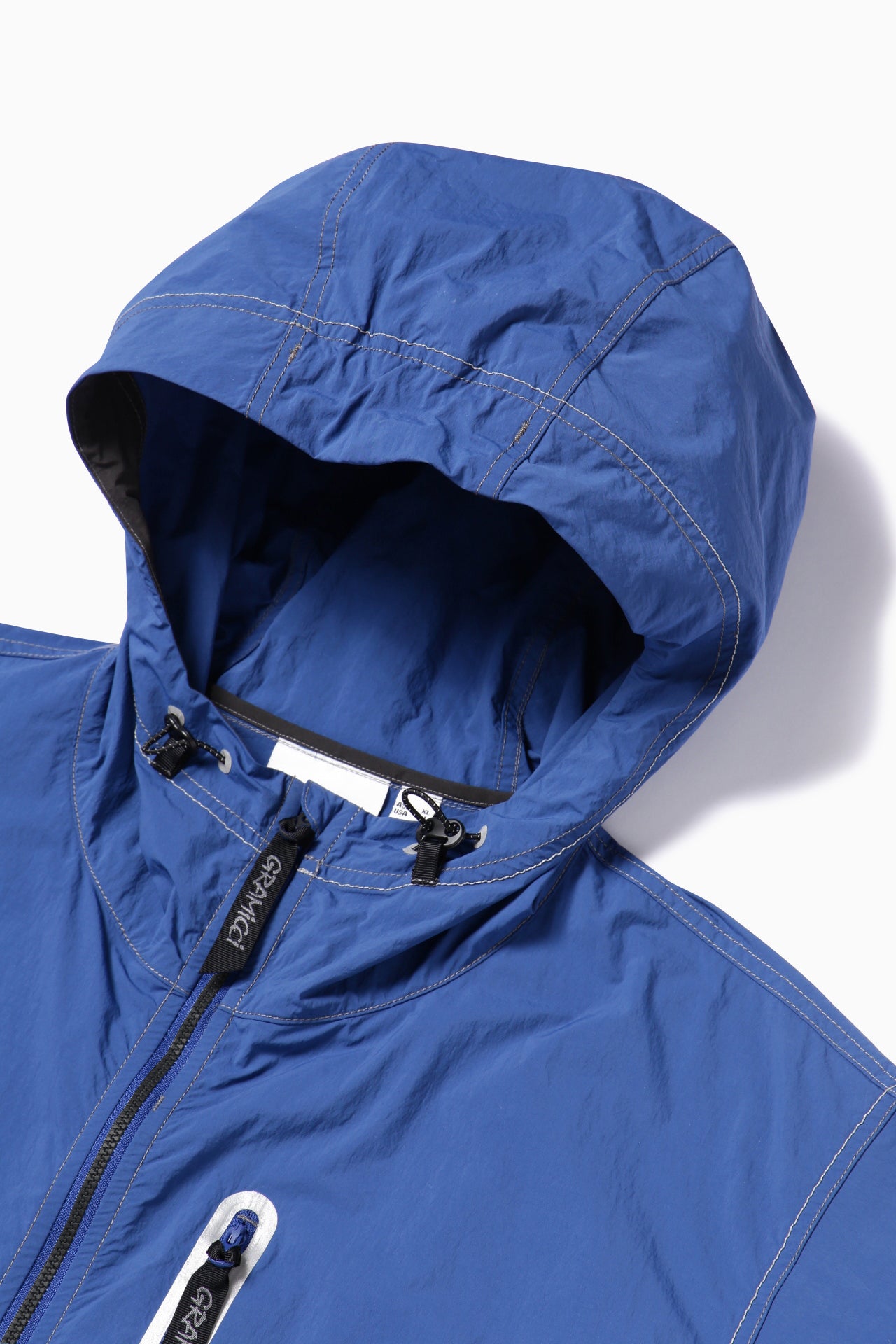【and wander】GRAMICCI × and wander brushed nylon jacket(5745121506)
