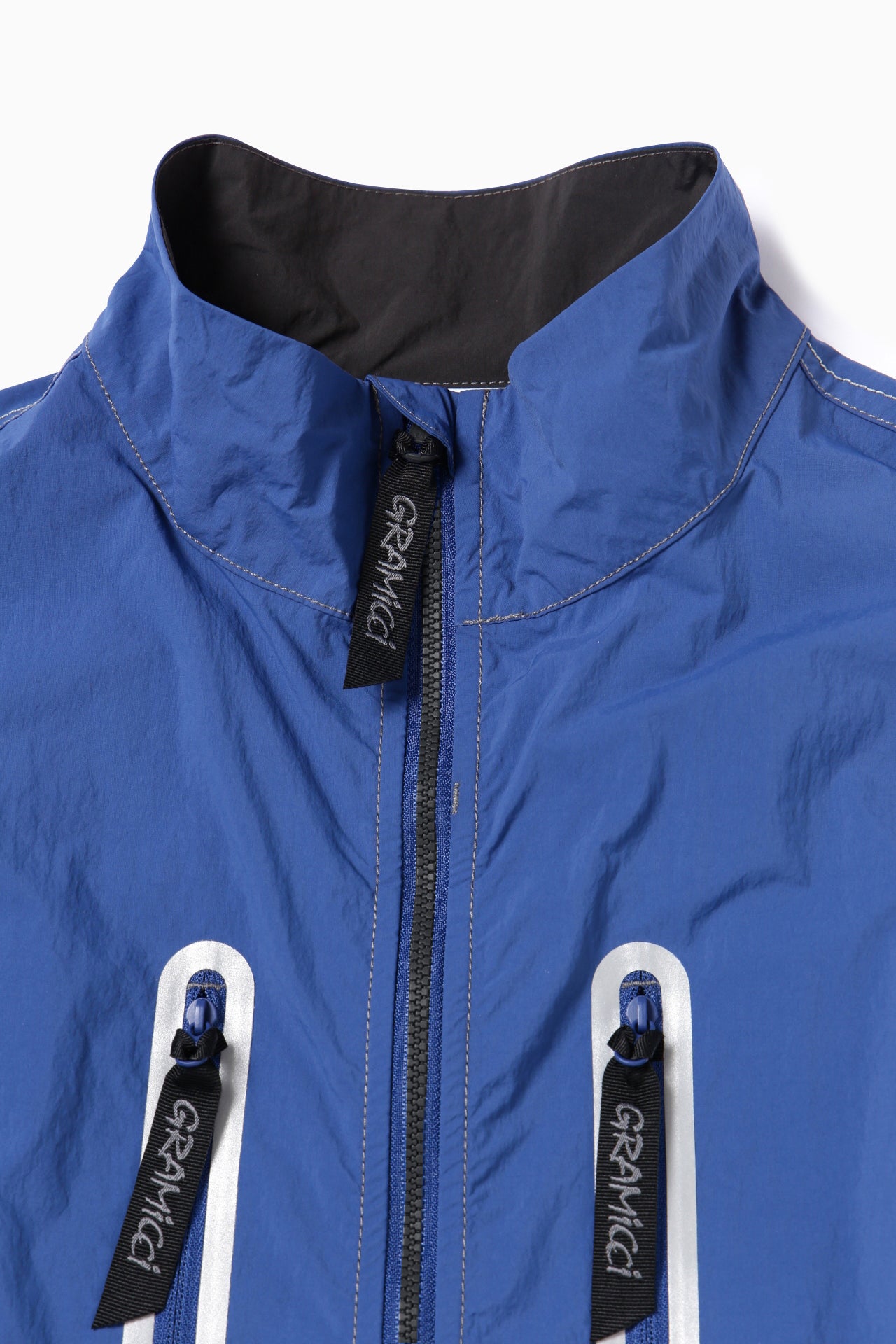 【and wander】GRAMICCI × and wander brushed nylon vest(5745121507)